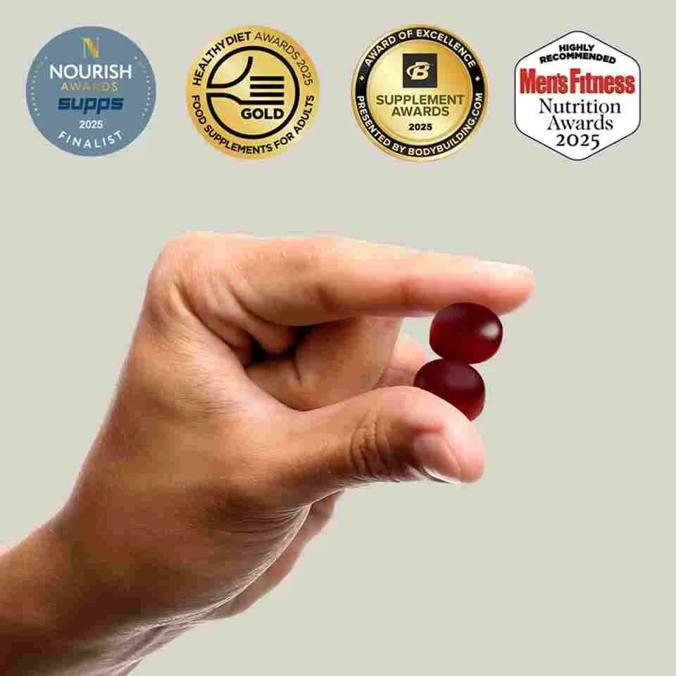 Four award seals printed on Himalla marketing material: Nourish Awards 2025 finalist, Healthy Diet Awards 2025 Gold, Bodybuilding.com Supplement Awards 2025 Award of Excellence, and Men&rsquo;s Fitness Nutrition Awards 2025 Highly Recommended, above a hand holding two red gummies